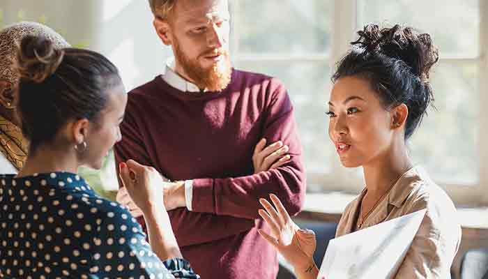 A business leader with her team