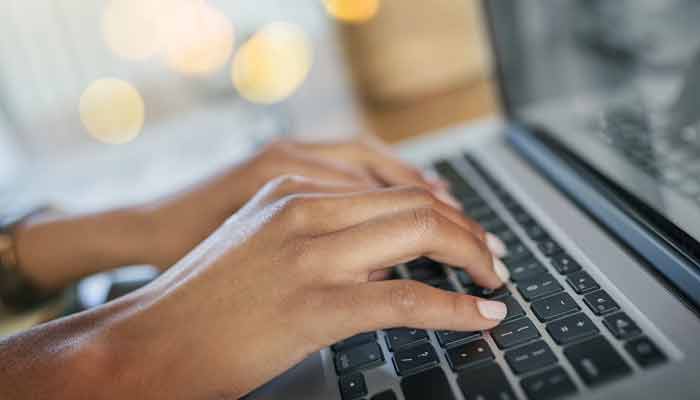 writer using their laptop